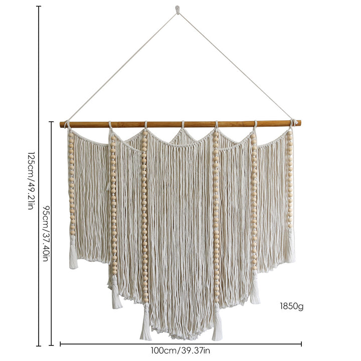 Macramé wall hanging with intricate fringes and wooden beads