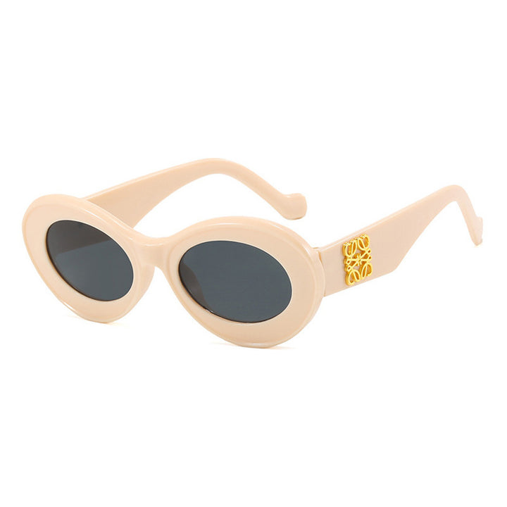 Women's fashionable sunglasses with oval frame and golden accents Kalsten