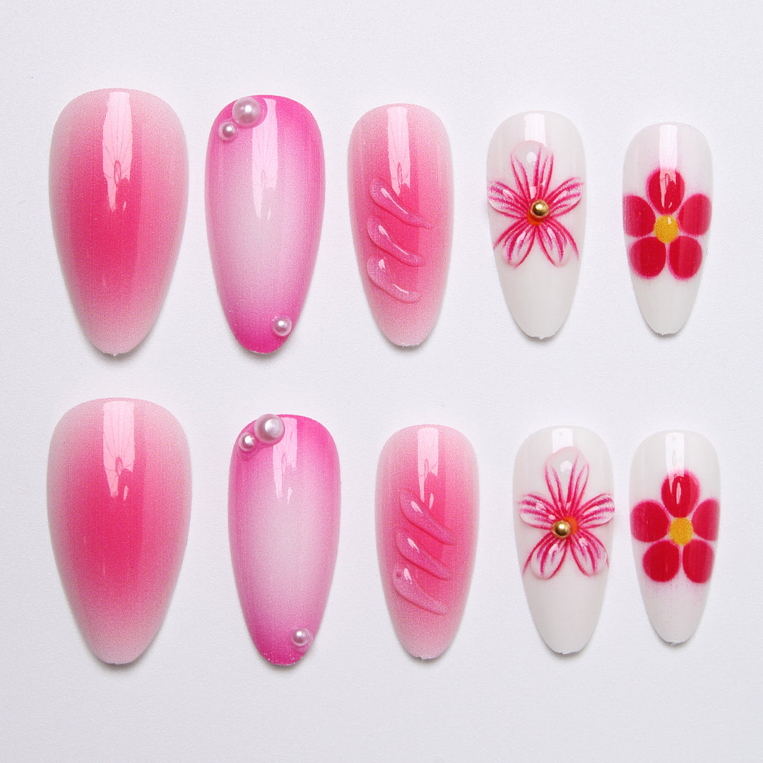 Artificial nail set with delicate flower designs and shimmering accents Kalsten