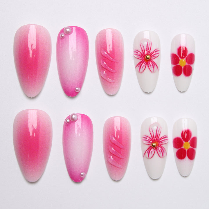 Artificial nail set with delicate flower designs and shimmering accents Kalsten