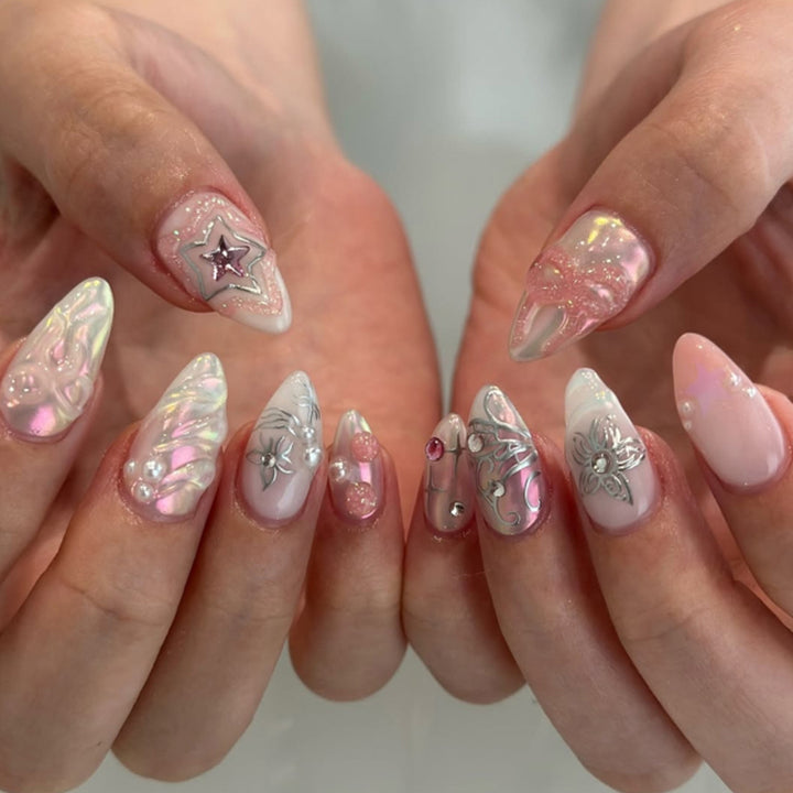 Artistic nail extensions with shiny embellishments Kalsten