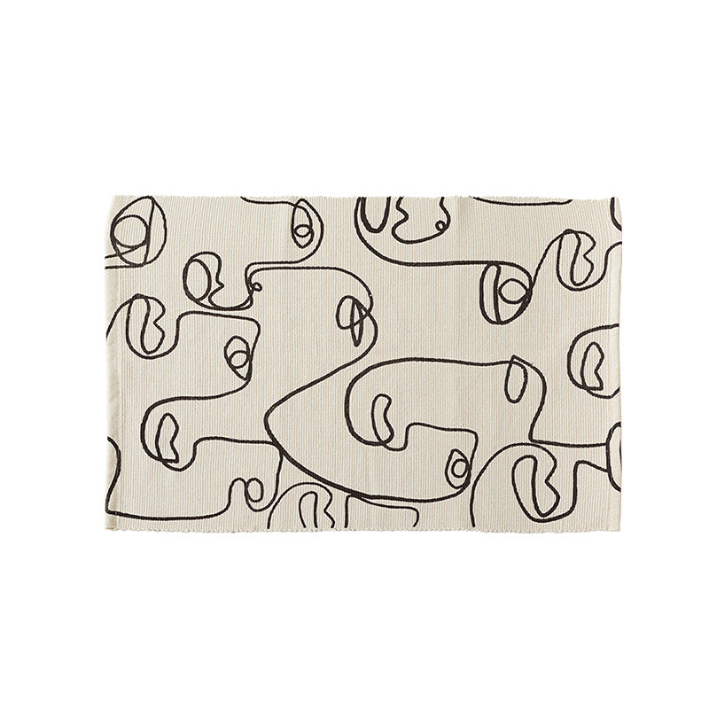 Table mat made of cotton fabric with abstract line art motif
