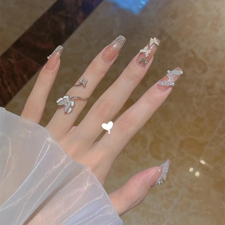 Trendy 3D design artificial nails with glitter and butterfly accents Kalsten