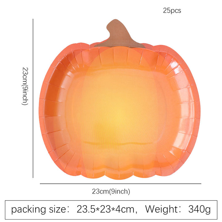 Disposable paper plates in pumpkin shape with spooky face design