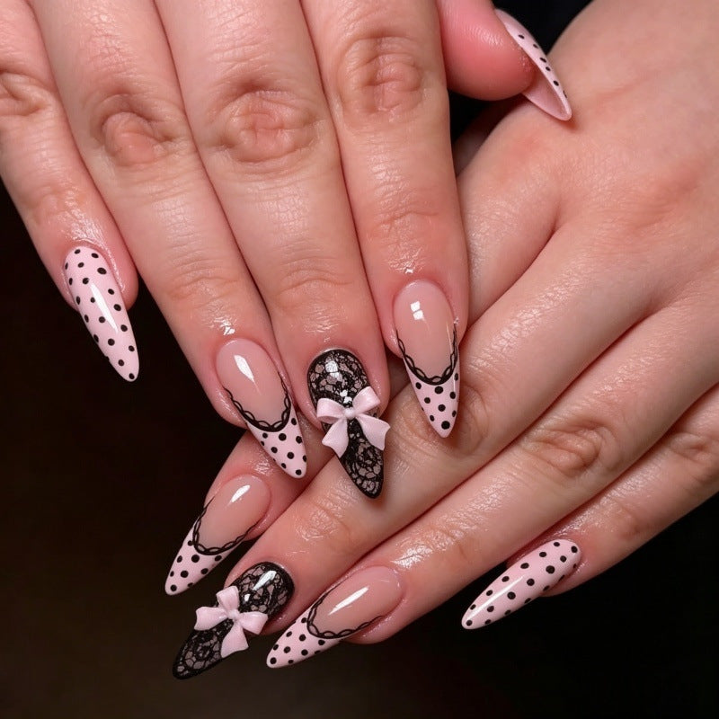 Elegant artificial nails with lace design and bow accents Kalsten