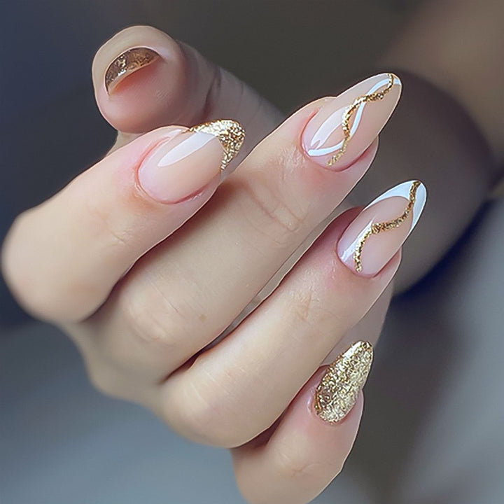 Artful nail art with elegant gold design Kalsten