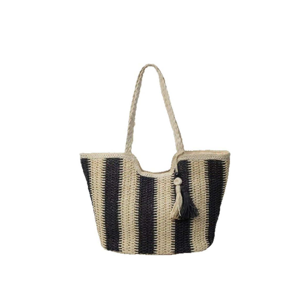 Handcrafted straw bag with elegant tassels and detailed texture Kalsten