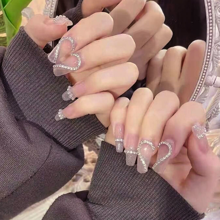 Glamorous artificial nails with heart and glitter design Kalsten