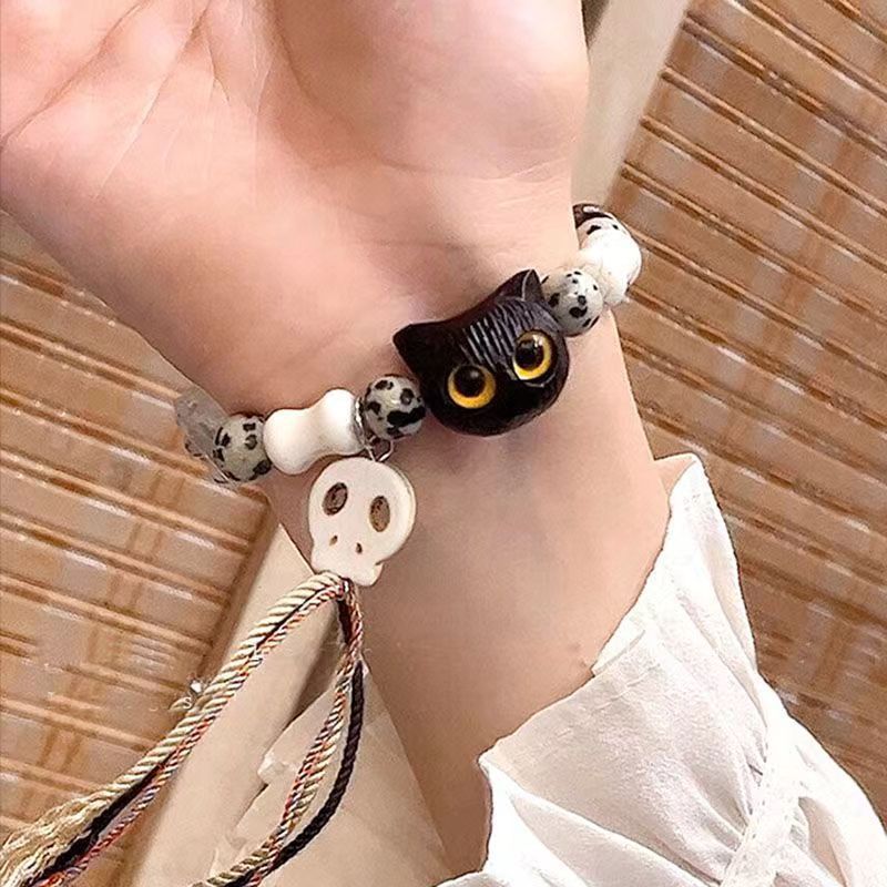 Whimsical Cat and Bone Charm Bracelet Kalsten
