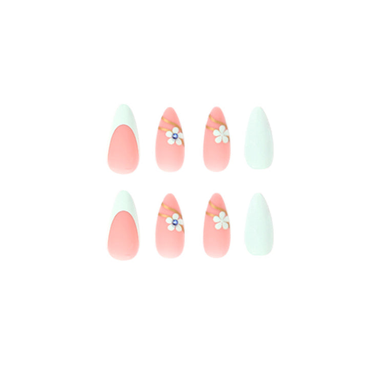 Artistic stiletto nails with floral accents and glitter embellishments Kalsten