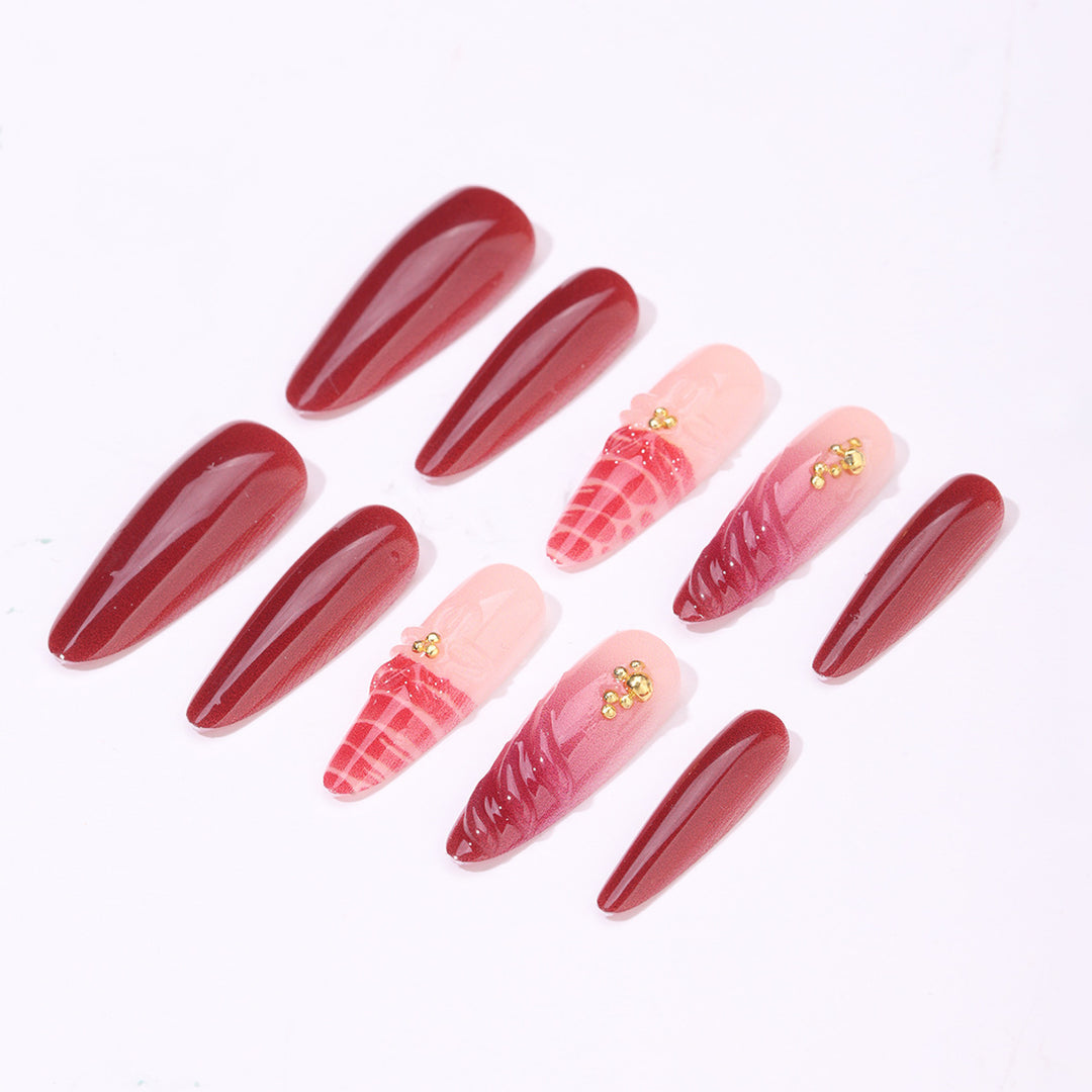 Artificial nail set with modern stiletto design and impressive flower appliqué Kalsten