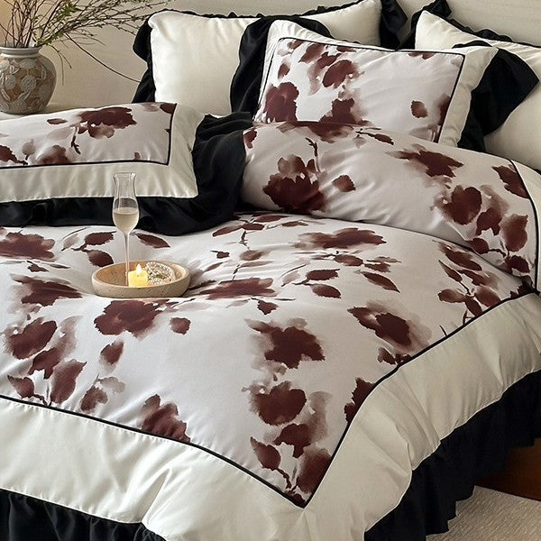 Luxury bed cover set made of cotton satin with abstract watercolor flower print and contrasting ruffle
