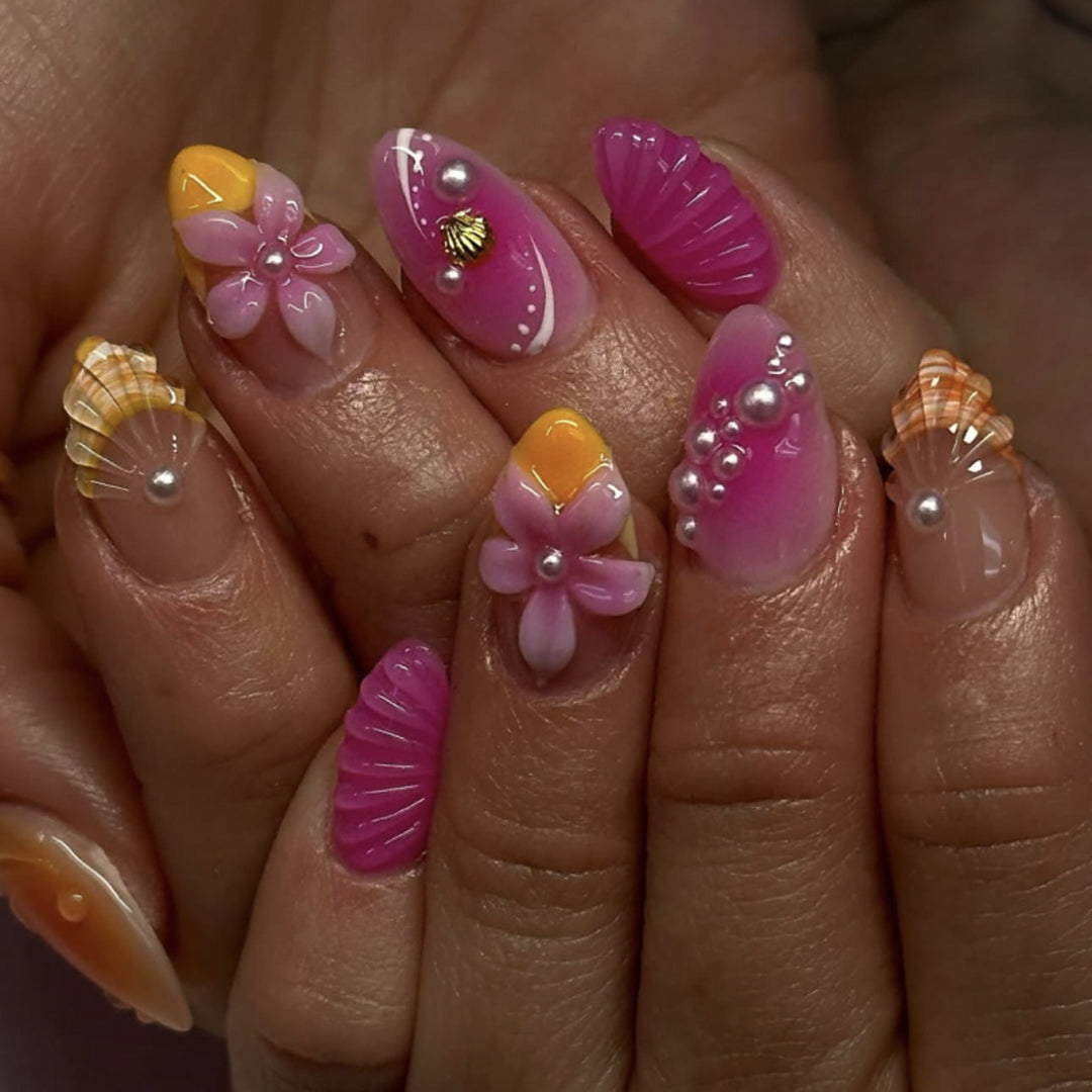 Artful nail extensions with floral and pearl-embellished accents Kalsten