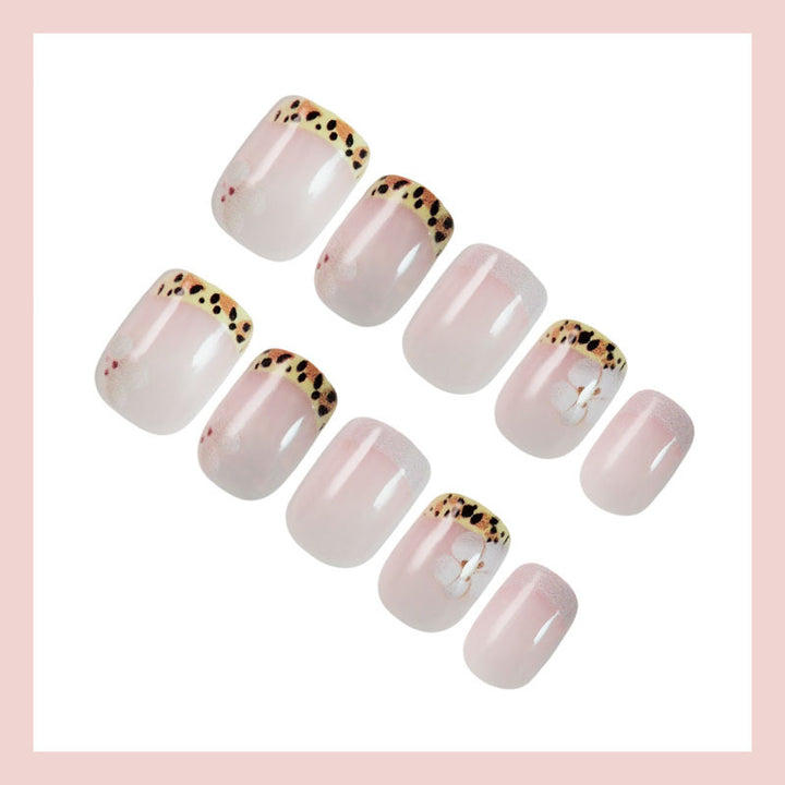 Artificial nail set with elegant French tip and floral accent Kalsten