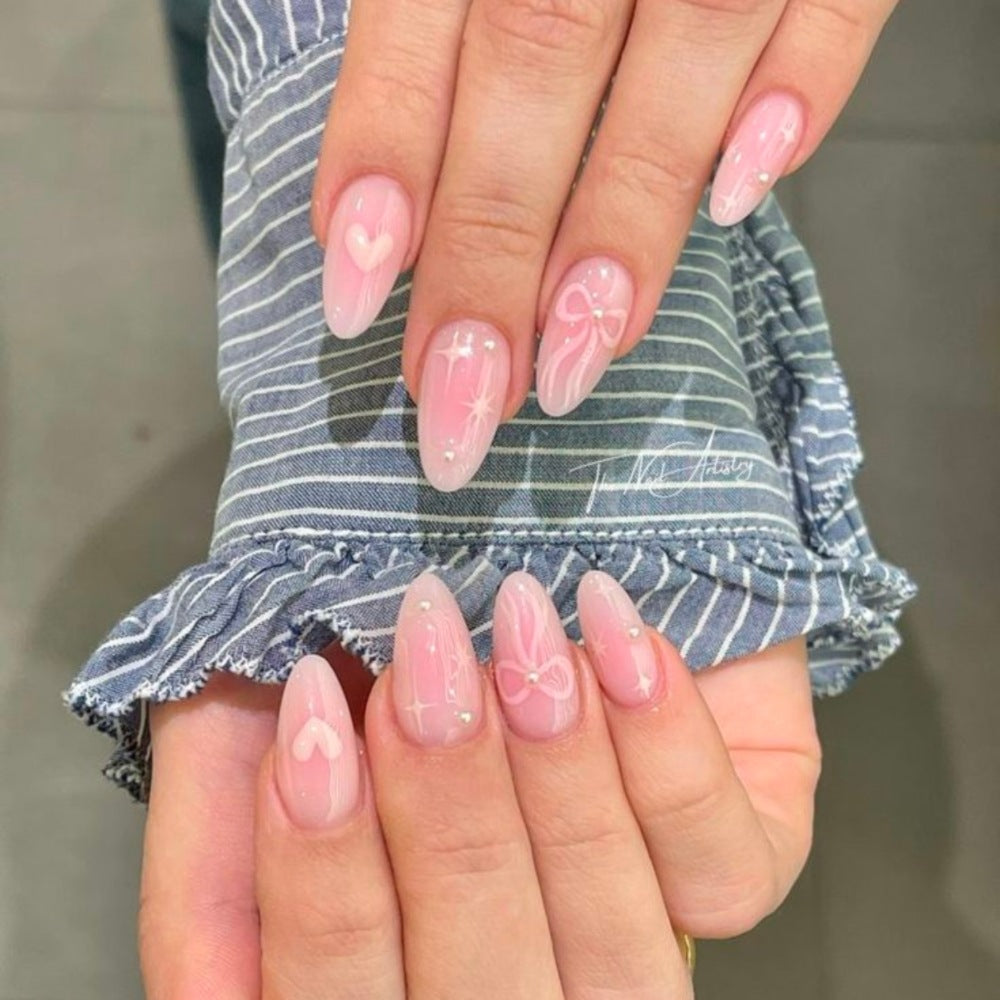 Artistic Heart-Embellished Stiletto Nail Enhancements