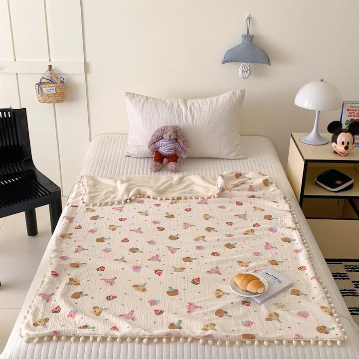 Children's Wende cuddly blanket made of cotton muslin with pompom border
