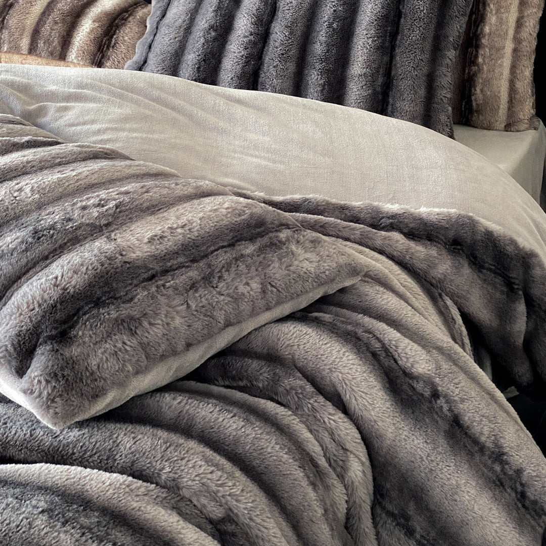 Luxury faux fur throw and cushion set with striped texture