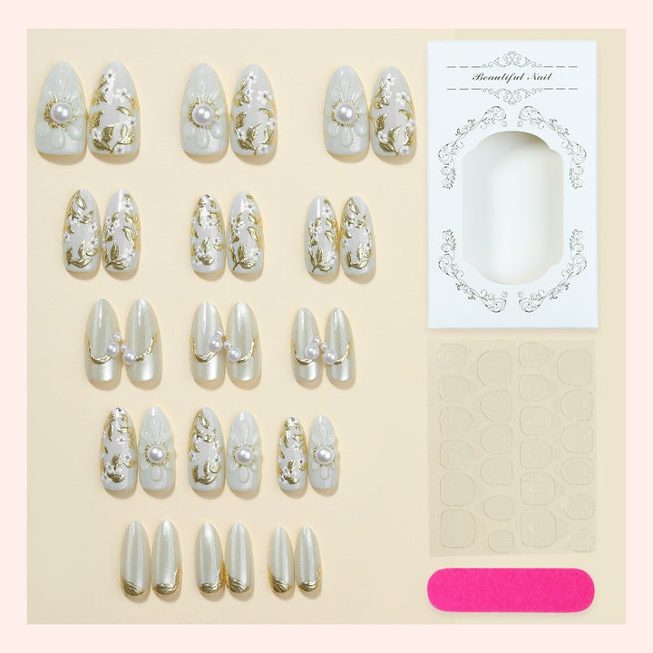 Acrylic nail set with elegant floral designs and glamorous glitter accents Kalsten