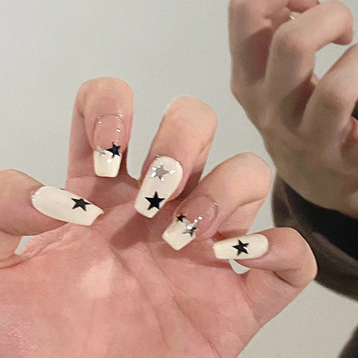 Artificial nail set with glamorous star design and sparkling accents Kalsten