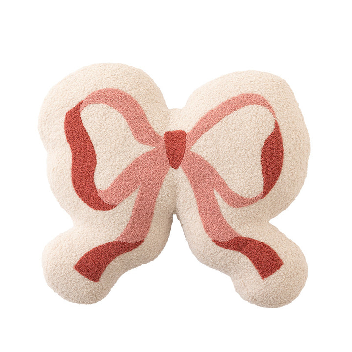 Bow decorative cushion made of boucle with fluffy teddy look