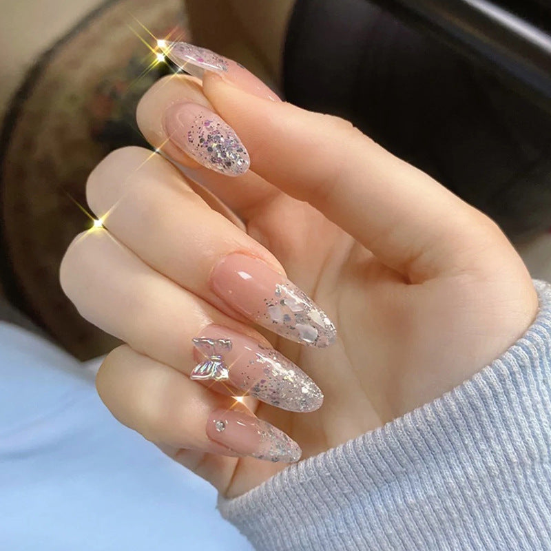 Glittering stiletto nails with elegant decorations Kalsten