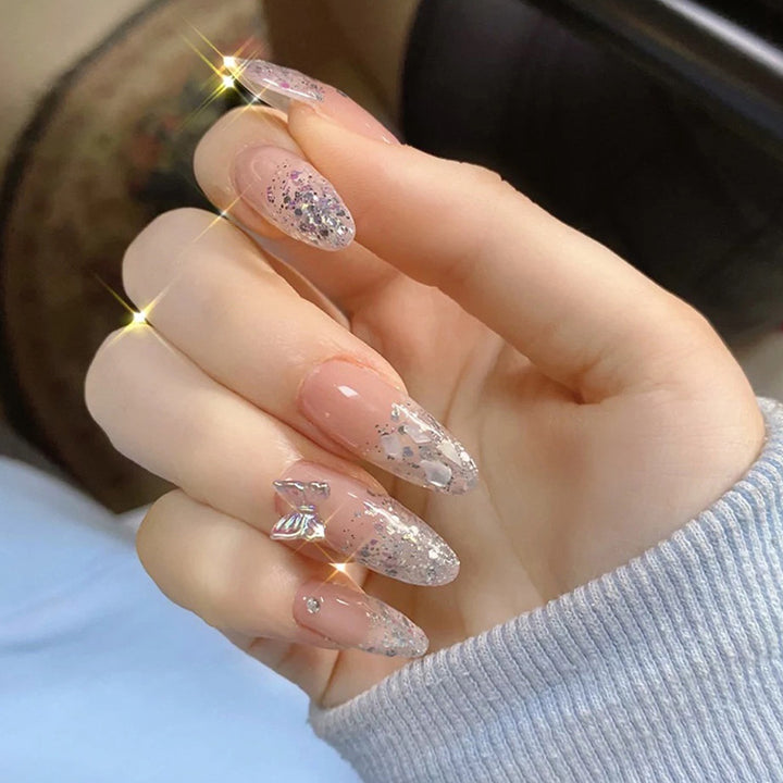 Glittering stiletto nails with elegant decorations Kalsten
