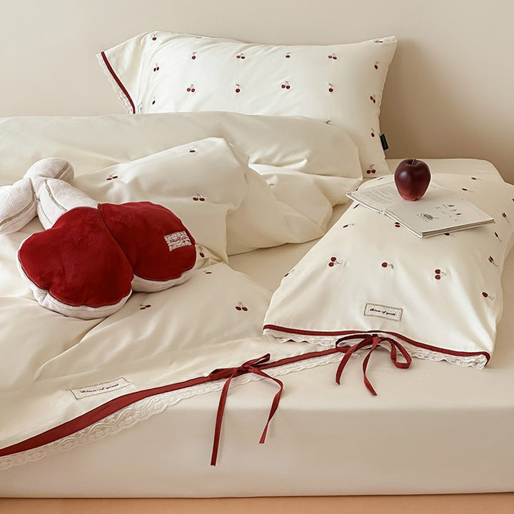 Romantic cotton satin duvet cover set with embroidered cherries, lace trim, and ties