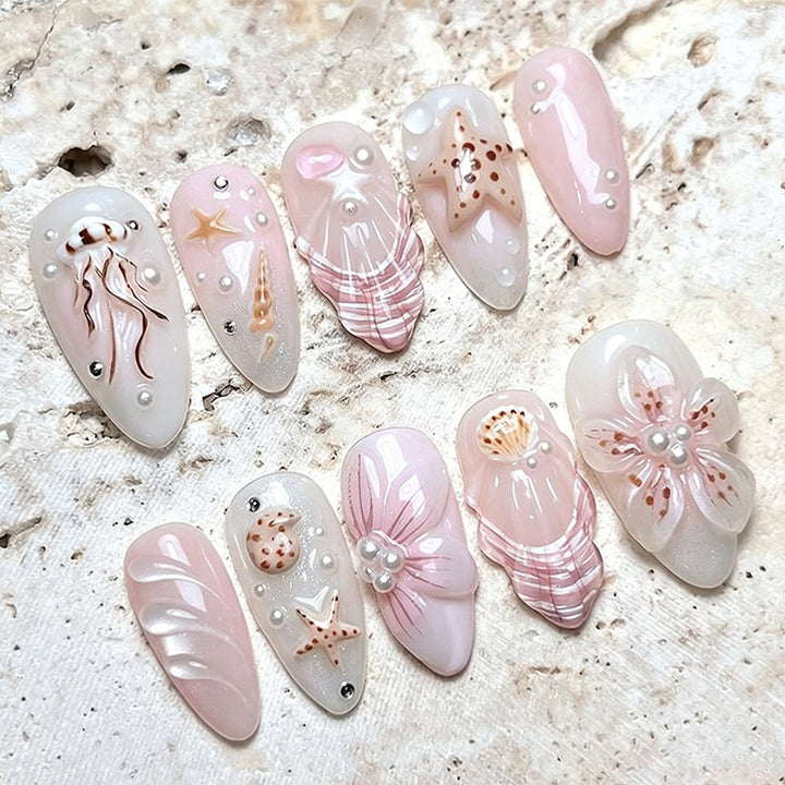 Artificial nails with maritime motifs and pearl embellishments Kalsten