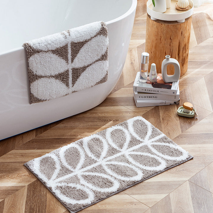 Fluffy bath mat in a graphic wave relief with anti-slip base Kalsten
