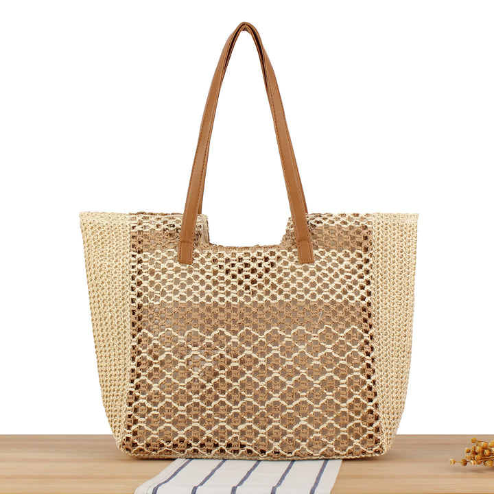 Shopping bag made of woven natural material with elegant leather handles Kalsten