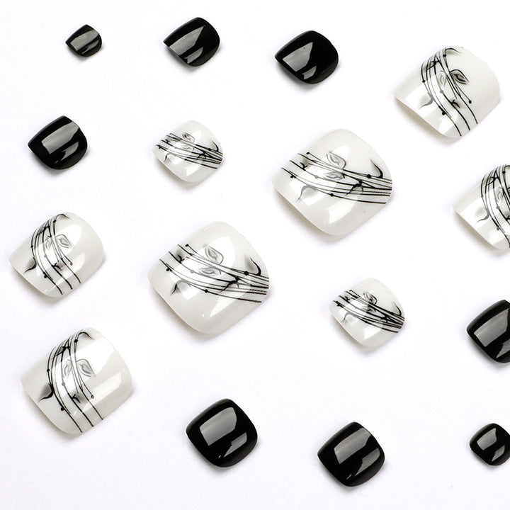 Artful toenail art in elegant black and white design Kalsten