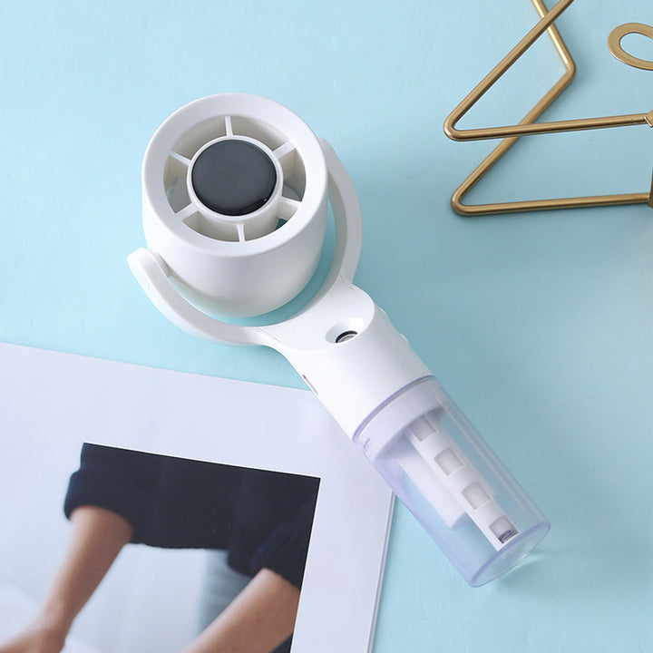 Cooling handheld misting fan with swivel air head detachable water reservoir and USB rechargeable battery Kalsten