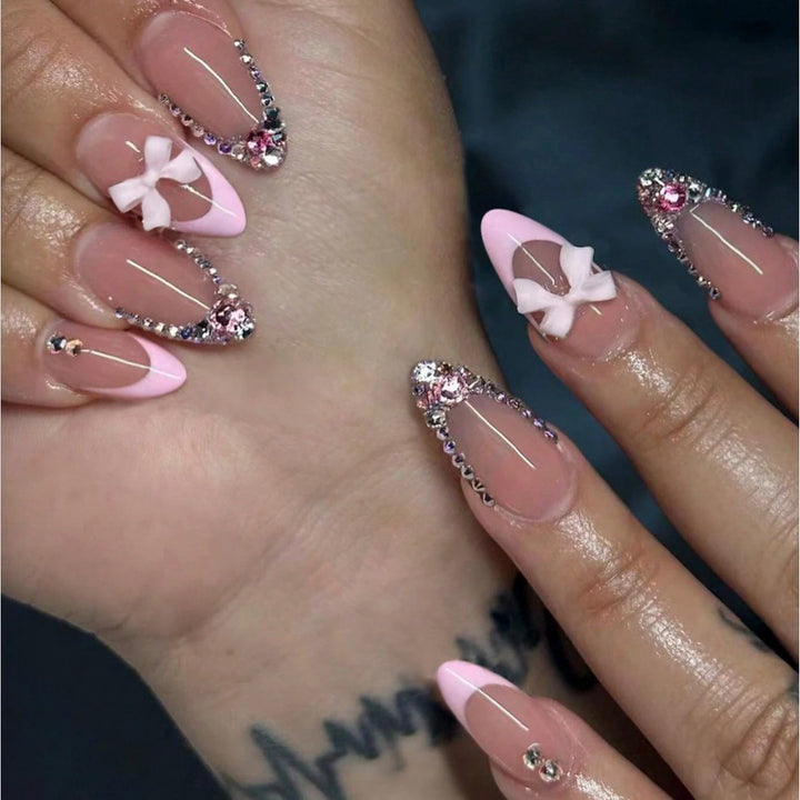 Acrylic nail set with elegant 3D bows and sparkling rhinestone embellishments Kalsten
