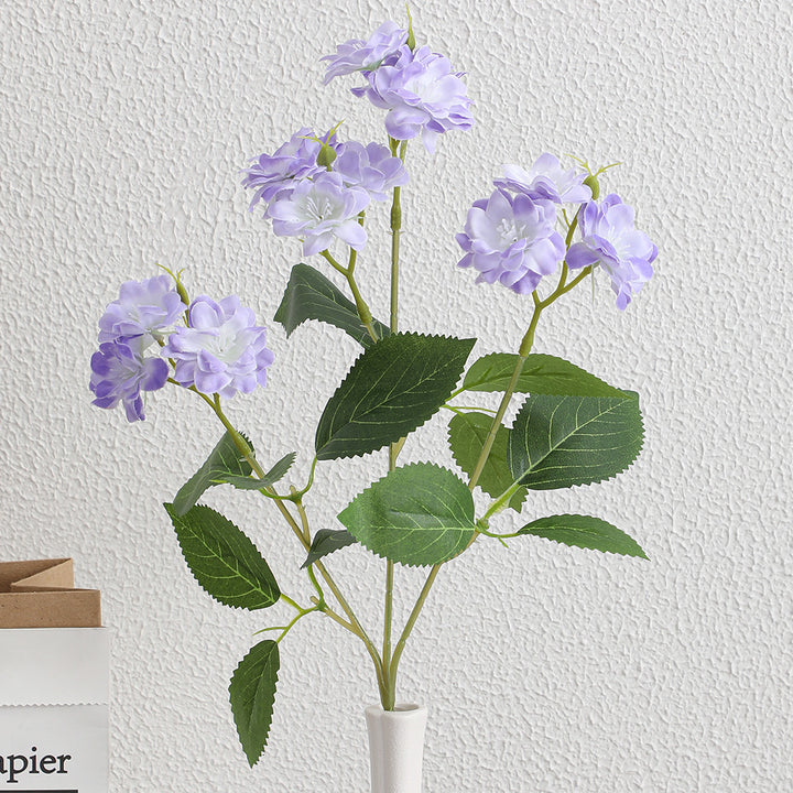 Artificial flower arrangement with delicate white blooms