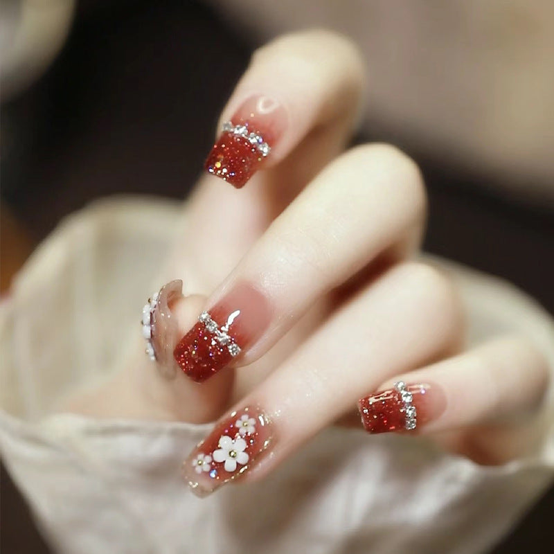 Artistic Press-On Nail Art with Floral and Glitter Accents Kalsten