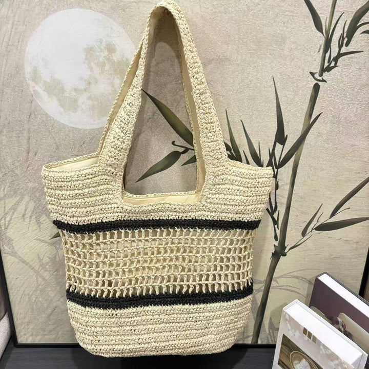 Woven natural material handbag with elegant structure Kalsten