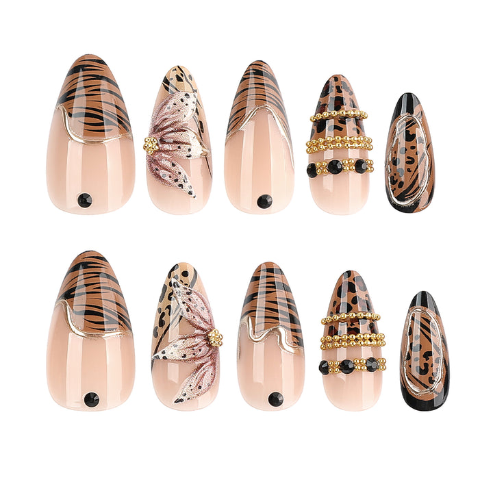 Artful stiletto nail with floral accents and gold embellishments Kalsten