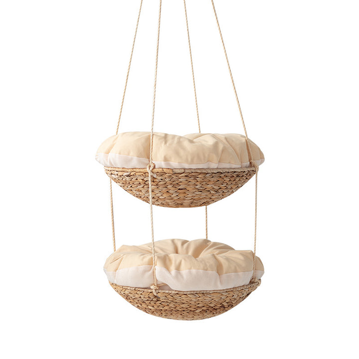 Hanging chair made of braided natural material with comfortable cushions Kalsten