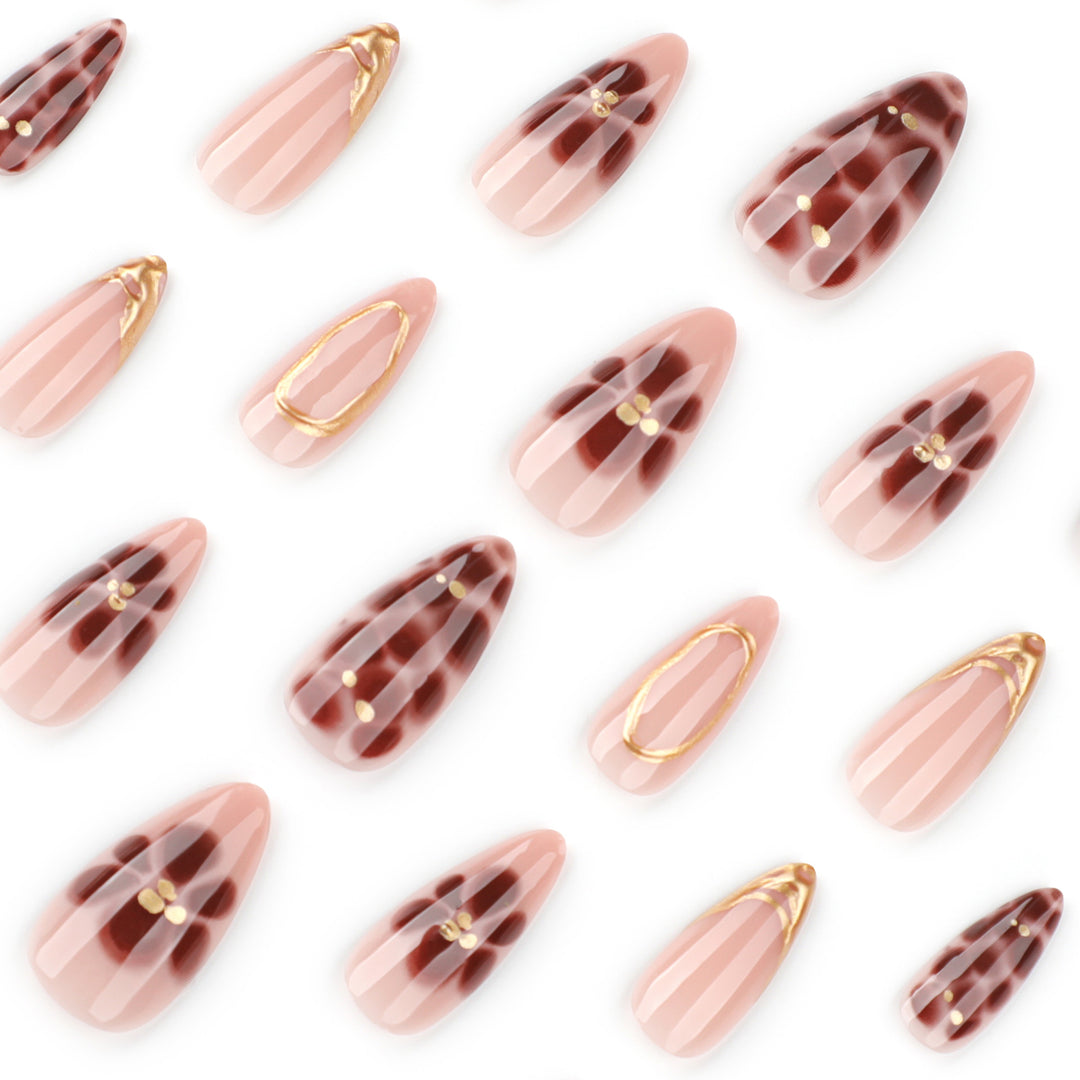 Elegant artificial nails with floral accents and gold details Kalsten
