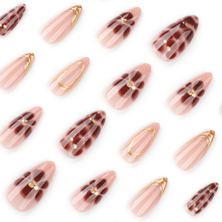 Elegant artificial nails with floral accents and gold details Kalsten