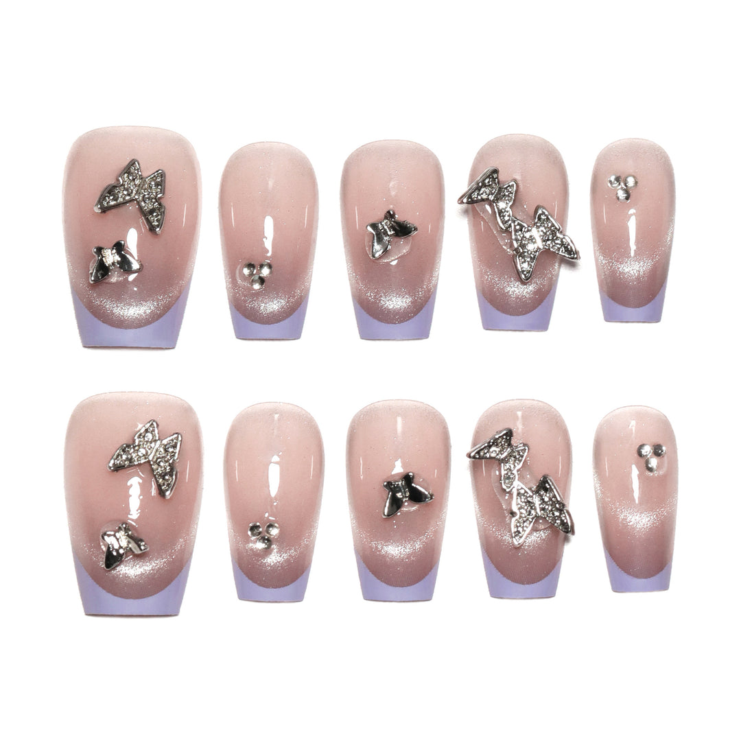 Artificial nail extensions with glitter design and elegant accents Kalsten