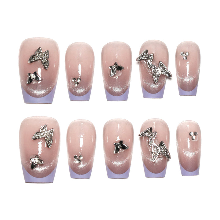 Artificial nail extensions with glitter design and elegant accents Kalsten