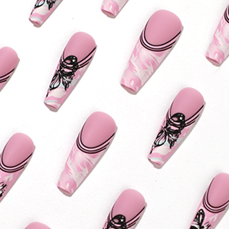 Artificial nail art with delicate butterfly designs Kalsten