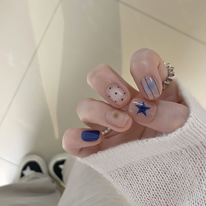 Artificial nails in modern design with geometric and sparkling accents Kalsten