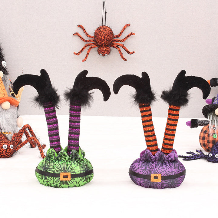 Skurrile Halloween table figure with standing witch legs and spider web sack