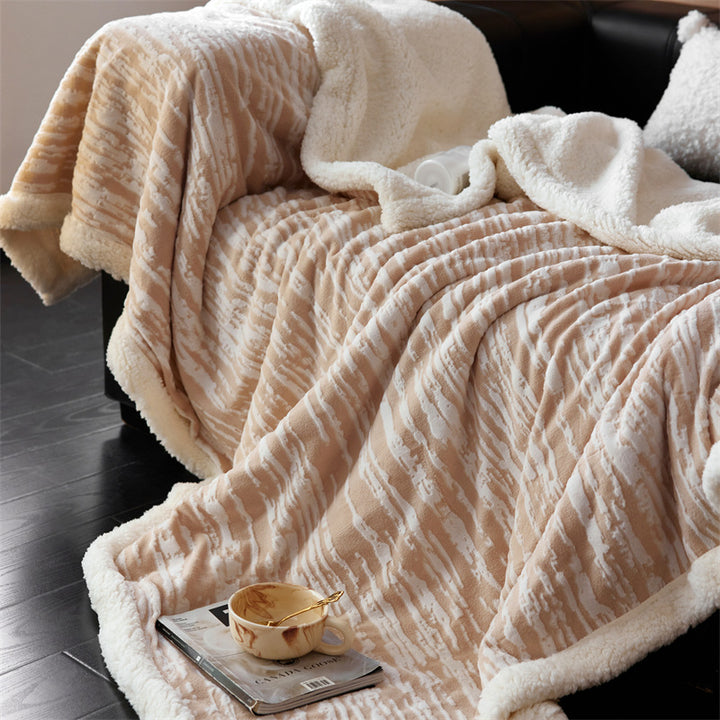 Cozy throw blanket with Sherpa lining and jacquard pattern