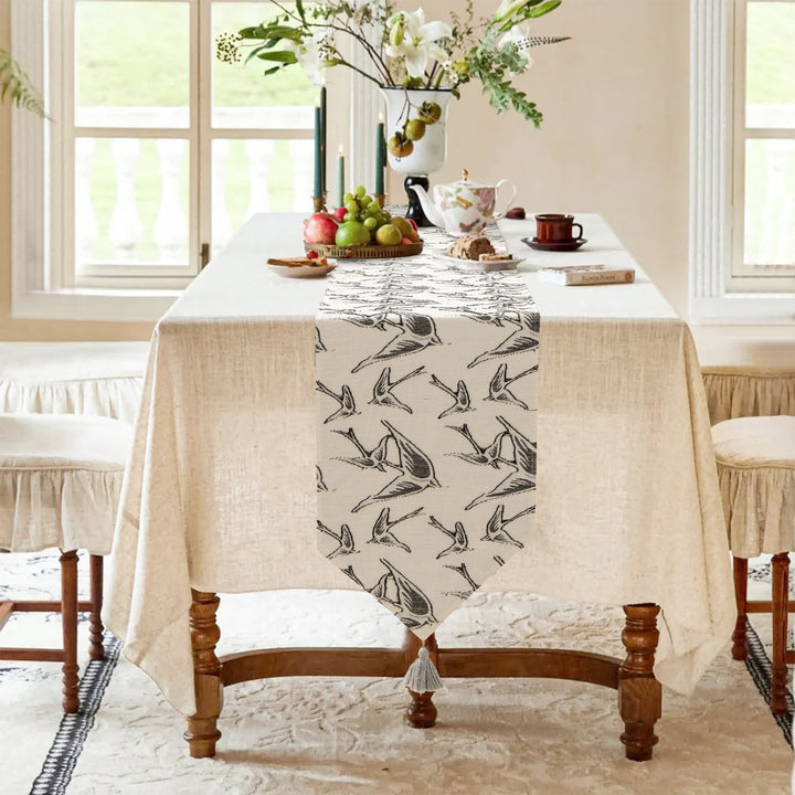 Woven double-sided linen table runner with tassels and hand-drawn swallow print Kalsten