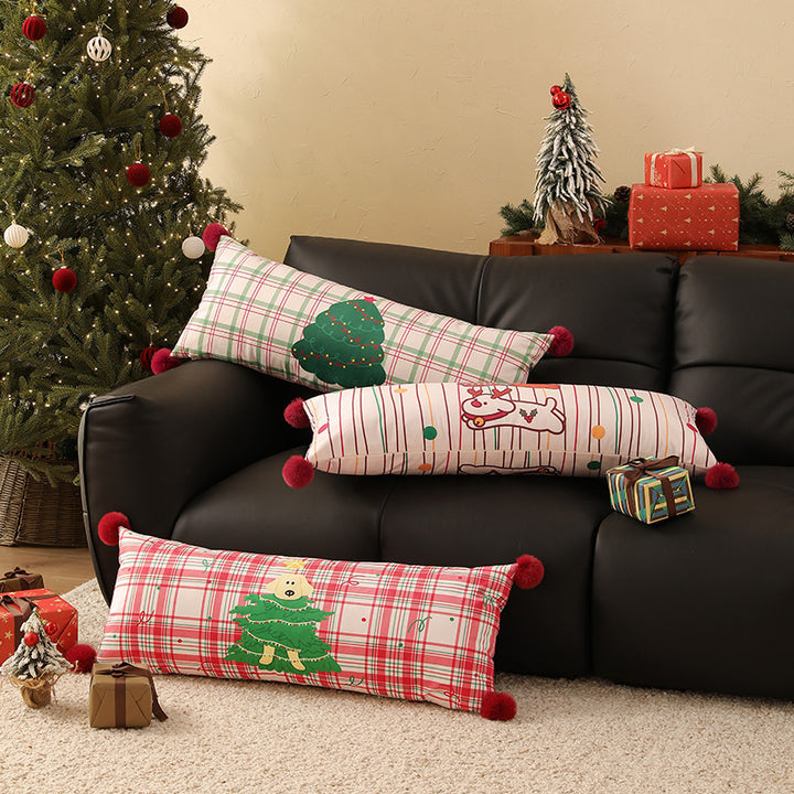 Long decorative lumbar and neck pillow in Christmas check with pompom and dog-tree motif Kalsten