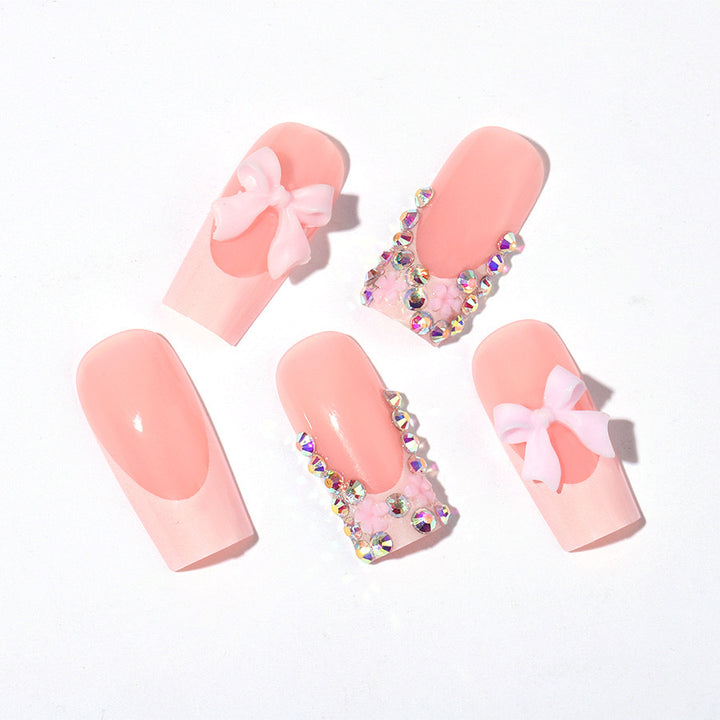 Artifical nail set with glamorous 3D bows and crystal embellishments Kalsten