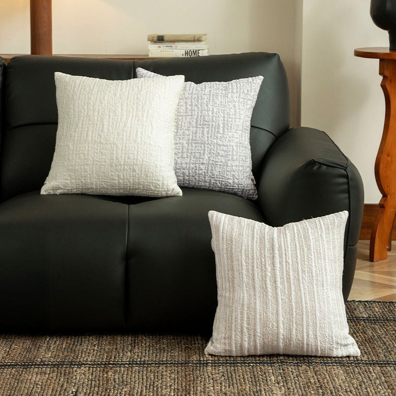 Square, quilted decorative pillow with woven texture Kalsten